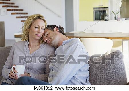 Man resting his head on a woman's shoulders View Large Photo Image Stock Image - Man resting his head on a woman's shoulders. Fotosearch