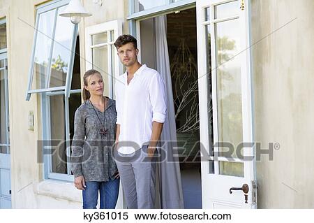 Portrait of a couple standing together outdoors View Large Photo Image Stock Photography - Portrait of a couple standing together outdoors. Fotosearch