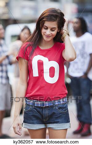 Beautiful woman smiling with her hands in hair View Large Photo Image Stock Photo - Beautiful woman smiling with her hands in hair. Fotosearch