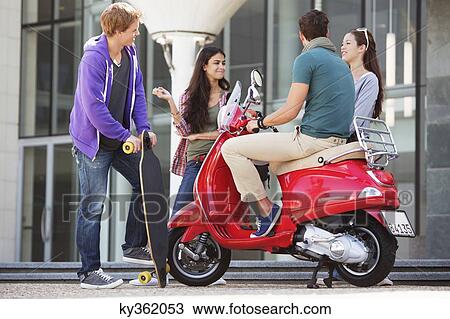 Friends having a conversation View Large Photo Image Stock Image - Friends having a conversation. Fotosearch