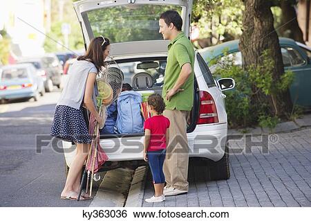 Family going on vacations View Large Photo Image Stock Photograph - Family going on vacations. Fotosearch