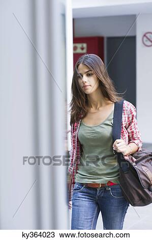 Beautiful woman walking in university View Large Photo Image Stock Image - Beautiful woman walking in university. Fotosearch
