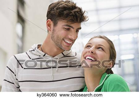 Stock Image - Happy couple looking at each other. Fotosearch