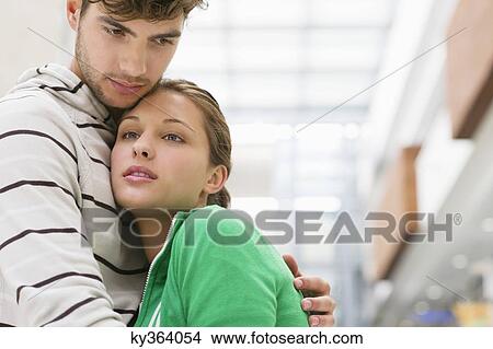 Man embracing a woman View Large Photo Image Picture - Man embracing a woman. Fotosearch
