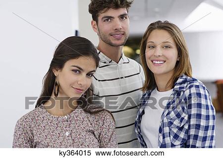 Portrait of three young friends standing together View Large Photo Image Stock Photography - Portrait of three young friends standing together. Fotosearch