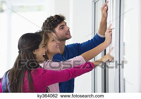 University students checking bulletin board for test result View Large Photo Image Stock Image - University students checking bulletin board for test result. Fotosearch