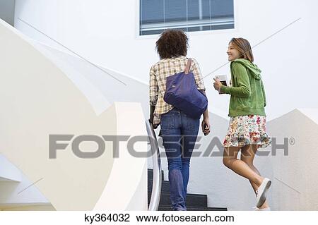 University students walking up on the staircase in university View Large Photo Image Stock Image - University students walking up on the staircase in university. Fotosearch