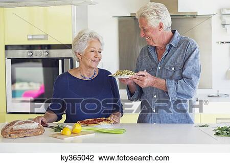 Man holding a plate of food View Large Photo Image Stock Image - Man holding a plate of food. Fotosearch