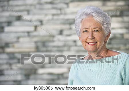 Portrait of a senior woman smiling View Large Photo Image Stock Photography - Portrait of a senior woman smiling. Fotosearch