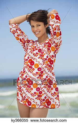 Portrait of a young woman posing on beach View Large Photo Image Stock Photography - Portrait of a young woman posing on beach. Fotosearch