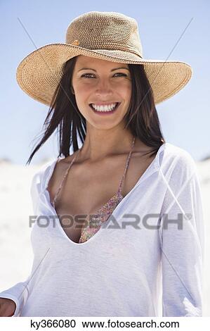 Portrait of a young woman smiling on the beach View Large Photo Image Stock Image - Portrait of a young woman smiling on the beach. Fotosearch