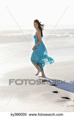 Young woman's footprint while running on a beach View Large Photo Image Stock Photography - Young woman's footprint while running on a beach. Fotosearch