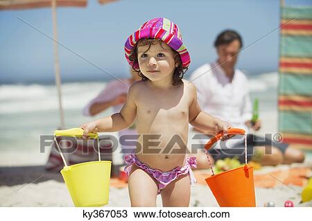 Cute girl carrying plastic basket View Large Photo Image Stock Image - Cute girl carrying plastic basket. Fotosearch