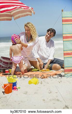 Family having good time on the beach View Large Photo Image Stock Image - Family having good time on the beach. Fotosearch