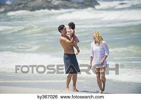 Family on the beach View Large Photo Image Stock Photograph - Family on the beach. Fotosearch