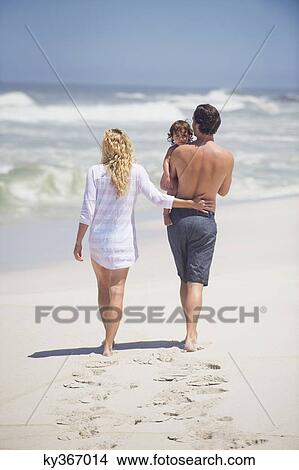 Family walking on the beach View Large Photo Image Picture - Family walking on the beach. Fotosearch