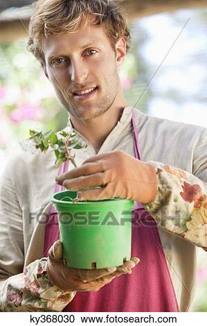 Portrait of a man gardening and smiling View Large Photo Image Stock Image - Portrait of a man gardening and smiling. Fotosearch