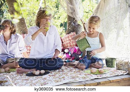 Children eating food in tree house View Large Photo Image Stock Photography - Children eating food in tree house. Fotosearch