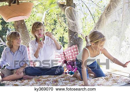 Children playing in tree house View Large Photo Image Stock Image - Children playing in tree house. Fotosearch