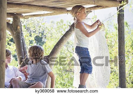 Children playing in tree house View Large Photo Image Stock Photo - Children playing in tree house. Fotosearch