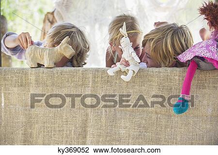 Children playing with toys in tree house View Large Photo Image Stock Image - Children playing with toys in tree house. Fotosearch