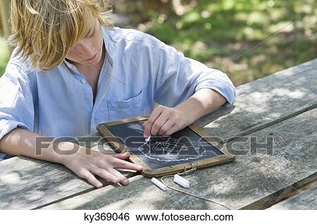 Little boy making drawing of tree on slate outdoors View Large Photo Image Stock Photograph - Little boy making drawing of tree on slate outdoors. Fotosearch