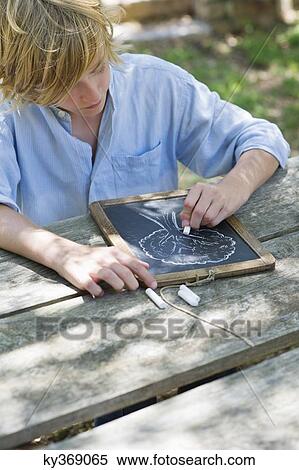 Little boy making drawing of tree on slate outdoors View Large Photo Image Stock Photography - Little boy making drawing of tree on slate outdoors. Fotosearch