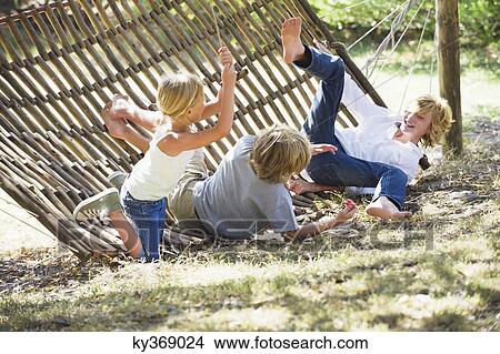 Little children falling down from hammock View Large Photo Image Picture - Little children falling down from hammock. Fotosearch