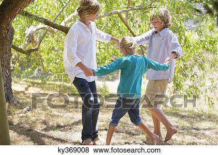 Little children playing outdoors View Large Photo Image Stock Photo - Little children playing outdoors. Fotosearch