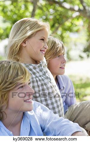 Side profile of cute little children looking away View Large Photo Image Stock Photo - Side profile of cute little children looking away. Fotosearch