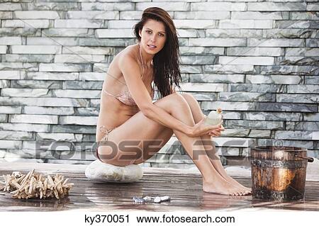 Portrait of a woman in bikini at a spa View Large Photo Image Stock Image - Portrait of a woman in bikini at a spa. Fotosearch