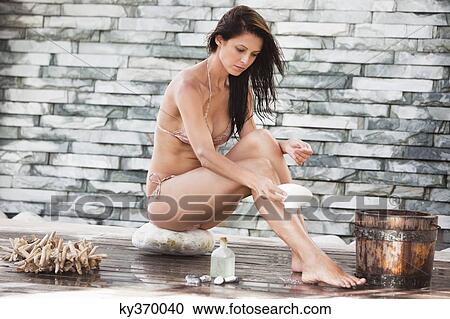 Woman in bikini at a spa View Large Photo Image Stock Image - Woman in bikini at a spa. Fotosearch