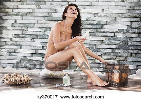 Stock Photo - Woman in bikini at a spa. Fotosearch