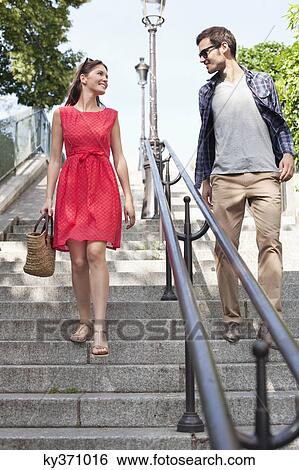 Couple moving down staircases, Montmartre, Paris, Ile-de-France, France View Large Photo Image Stock Photograph - Couple moving down staircases, Montmartre, Paris, Ile-de-France, France. Fotosearch