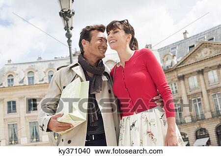 Couple on a street, Paris, Ile-de-France, France View Large Photo Image Stock Image - Couple on a street, Paris, Ile-de-France, France. Fotosearch