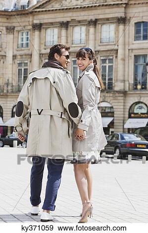 Couple walking on a street, Paris, Ile-de-France, France View Large Photo Image Stock Photo - Couple walking on a street, Paris, Ile-de-France, France. Fotosearch