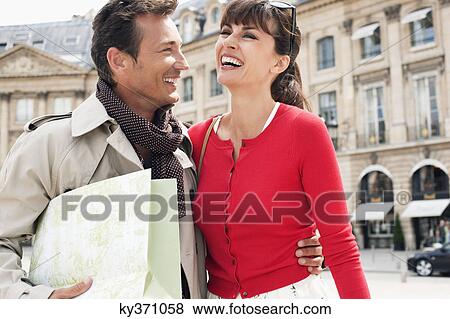 Happy couple on a street, Paris, Ile-de-France, France View Large Photo Image Stock Photo - Happy couple on a street, Paris, Ile-de-France, France. Fotosearch