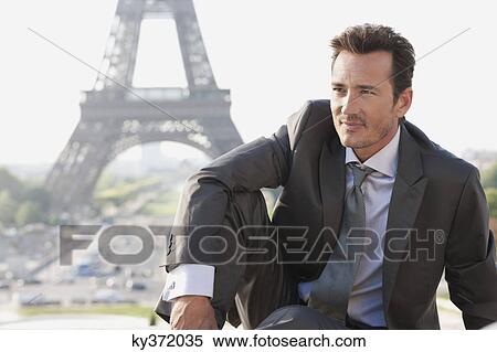 Businessman with the Eiffel Tower in the background, Paris, Ile-de-France, France View Large Photo Image Stock Photography - Businessman with the Eiffel Tower in the background, Paris, Ile-de-France, France. Fotosearch