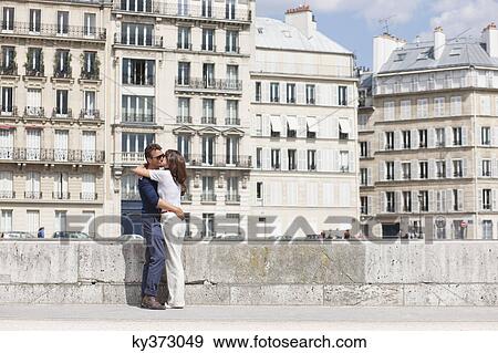 Stock Photo - Couple kissing each other, Paris, Ile-de-France, France. Fotosearch