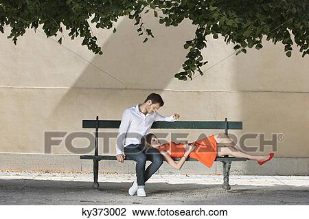 Couple on a bench in a garden, Terrasse De l'Orangerie, Jardin des Tuileries, Paris, Ile-de-France, France View Large Photo Image Stock Image - Couple on a bench in a garden, Terrasse De l'Orangerie, Jardin des Tuileries, Paris, Ile-de-France, France. Fotosearch