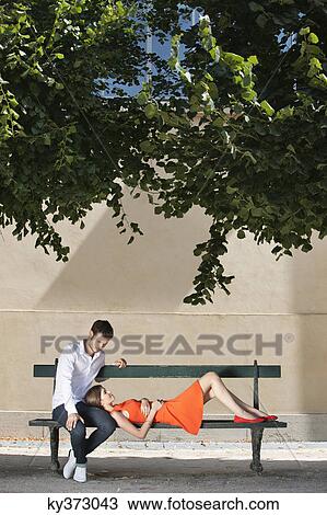 Couple on a bench in a garden, Terrasse De l'Orangerie, Jardin des Tuileries, Paris, Ile-de-France, France View Large Photo Image Stock Image - Couple on a bench in a garden, Terrasse De l'Orangerie, Jardin des Tuileries, Paris, Ile-de-France, France. Fotosearch