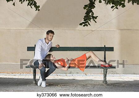 Couple on a bench in a garden, Terrasse De l'Orangerie, Jardin des Tuileries, Paris, Ile-de-France, France View Large Photo Image Stock Photograph - Couple on a bench in a garden, Terrasse De l'Orangerie, Jardin des Tuileries, Paris, Ile-de-France, France. Fotosearch