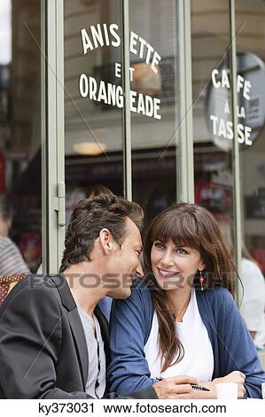 Couple sitting in a restaurant, Paris, Ile-de-France, France View Large Photo Image Stock Image - Couple sitting in a restaurant, Paris, Ile-de-France, France. Fotosearch
