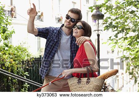 Stock Image - Couple smiling, Montmartre, Paris, Ile-de-France, France. Fotosearch