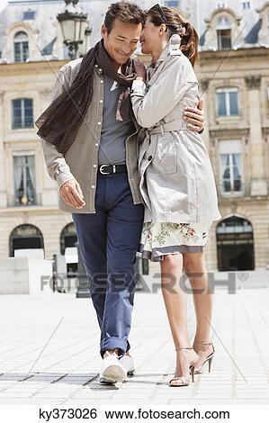 Couple walking on a street, Paris, Ile-de-France, France View Large Photo Image Stock Photograph - Couple walking on a street, Paris, Ile-de-France, France. Fotosearch
