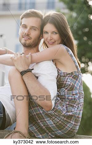 Stock Image - Portrait of a couple romancing, Paris, Ile-de-France, France. Fotosearch