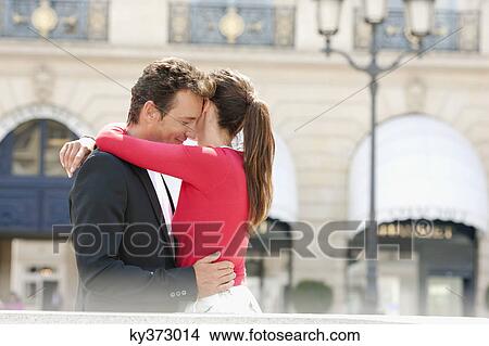 Picture - Romantic couple on a street, Paris, Ile-de-France, France. Fotosearch