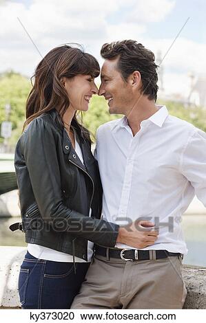 Romantic couple, Seine River, Paris, Ile-de-France, France View Large Photo Image Stock Image - Romantic couple, Seine River, Paris, Ile-de-France, France. Fotosearch