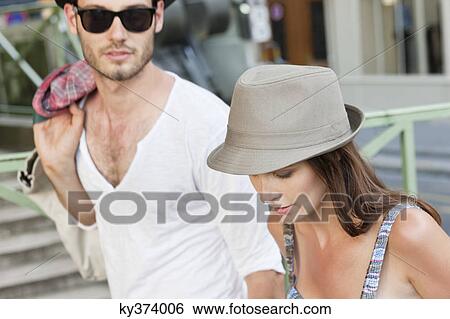 Stock Photograph - Close-up of a couple, Paris, Ile-de-France, France. Fotosearch