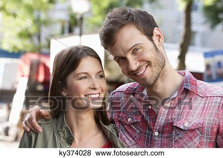 Close-up of a couple smiling, Paris, Ile-de-France, France View Large Photo Image Stock Photo - Close-up of a couple smiling, Paris, Ile-de-France, France. Fotosearch
